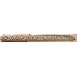 A cast iron 'Sandford Street' road sign in very weathered condition, length 146cm.