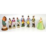 A set of three ceramic period soldiers, two matching period soldiers and a bisque figurine,