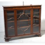 An Edwardian mahogany display cabinet, three interior shelves,