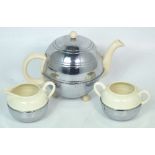 A retro ceramic and metal 'Nevacold' tea service to include a teapot, milk jug and sugar bowl (3).