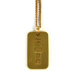 A 9ct gold ingot pendant on an 8ct gold link chain, approx 42g.
