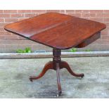 A Victorian mahogany foldover card table with fluted quadripartite base and castors, width 89cm.