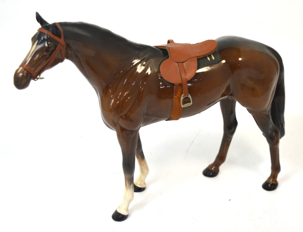 A large brown Beswick horse, length 35cm.