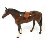 A large brown Beswick horse, length 35cm.