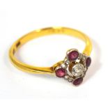 An 18ct yellow gold diamond and ruby ring with pierced lozenge shaped platform, size M/N, approx 2g.