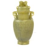 A Chinese carved jade vase and cover,