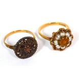 A 9ct gold ladies' dress ring set with garnets and a 9ct gold dress ring set with central yellow