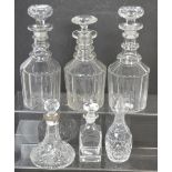 A near pair of clear glass decanters with double ring necks,