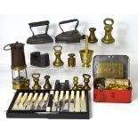 A quantity of metalware to include brass weights, a brass pestle and mortar, a portable brass stove,