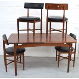 A retro G-Plan rectangular dining table on rounded tapering legs and four matching dining chairs