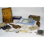 A collectors' lot comprising silver plated items to include flatware, knife rests, vanity sets,