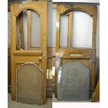 Two oak doors with arched opaque glass top over lower panel with some original door furniture,