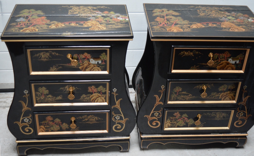 A pair of black lacquer Oriental side cabinets with three drawers,