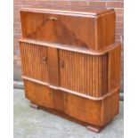 A retro tambour front cocktail cabinet with fitted interior, width 104cm.