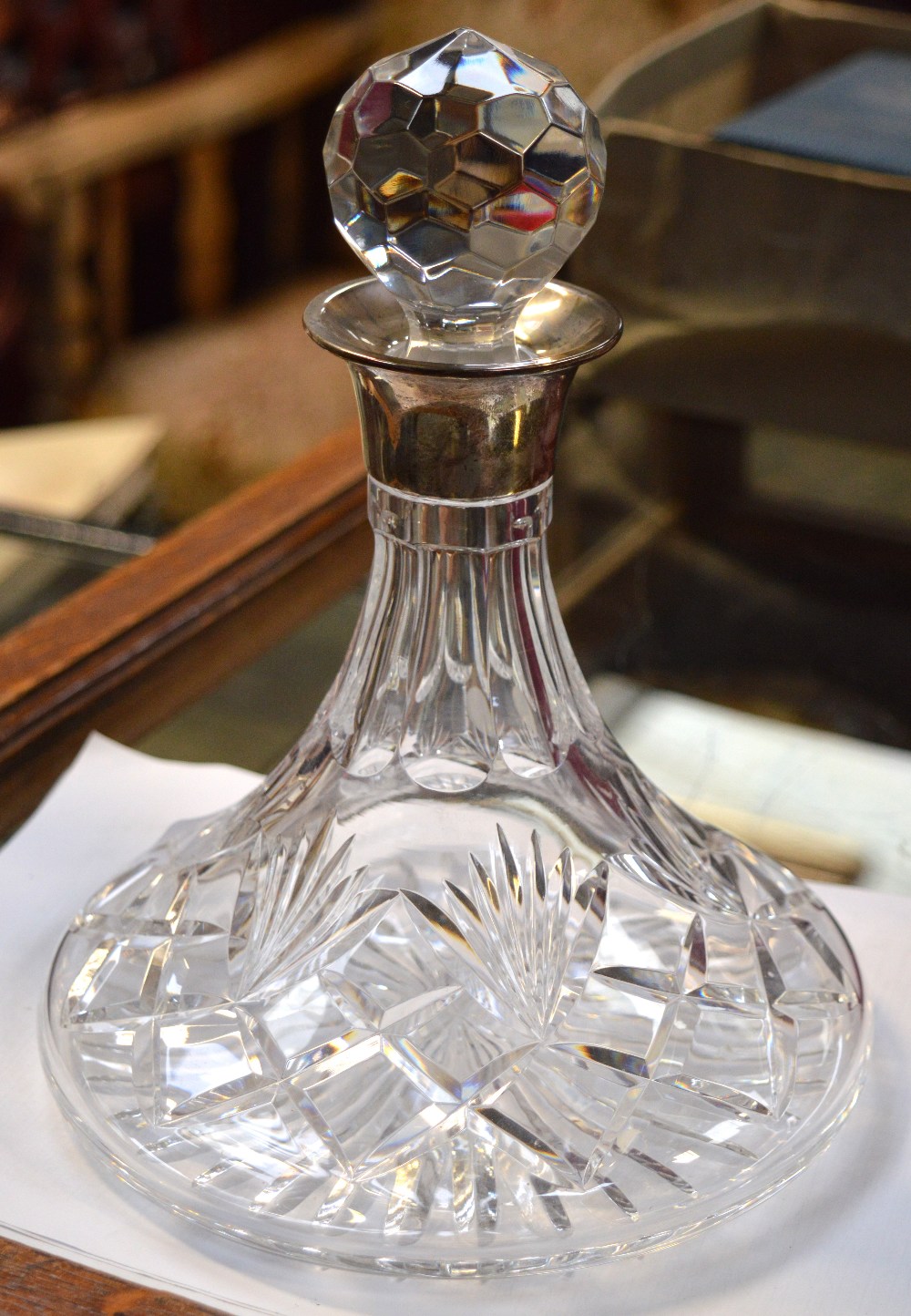 A cut glass ship's decanter with Elizabeth II hallmarked silver collar, Birmingham 2004.