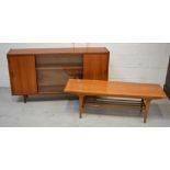 A retro c1960s rectangular coffee table with lower slat shelf on tapering legs,