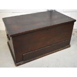 A rectangular blanket box with twin cast iron handles on plinth base,