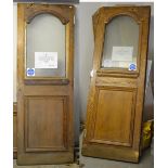 Two oak doors with arched opaque glass top over lower panel with some original door furniture,