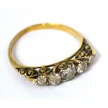 An 18ct yellow gold and graduated diamond five stone ring, size L/M, approx 2.3g.