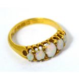 An 18ct yellow gold five stone graduated opal ring, size K, approx 3.9g.