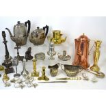 A quantity of metalware to include a copper jug, brass candlesticks, a metal lamp stand,