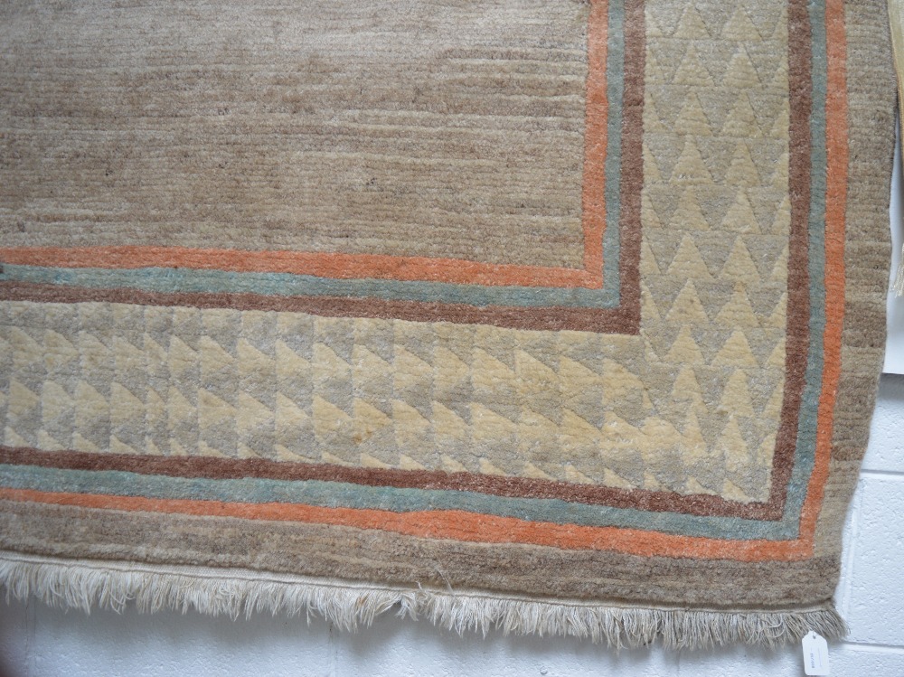 A Tibetan carpet with cotton warp and weft and hand spun woollen pile, approx 302 x 201cm.