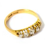 An 18ct yellow gold five stone graduated diamond ring, size N, approx 2.6g.