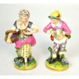 A pair of late 19th century Sampson Derby style figures, she carrying a basket of flowers,