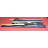 Three snooker cues including a Pot Black Sovereign with separate extension piece,