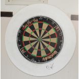 A Winmau Blade 4 dart board with foam surround.