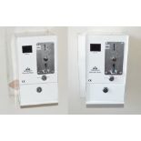 Two wall mounted Peradon Timesafe Meters pay-per-use light switches (2).