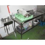 A quantity of stainless steel commercial kitchen fittings including two counters, a deep sink,