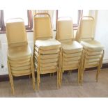 Twenty-five gold painted and gold upholstered stacking chairs (25).