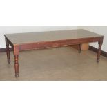 A large rectangular table with replaced Formica top.