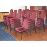 Fifty-eight grey painted and maroon upholstered stacking chairs (58).