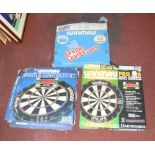 Three boxed Winmau dart boards (3).