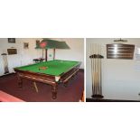 A full size slate bed snooker table with reeded legs, with accessories.