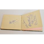 An autograph book, signed by various golfers, including Peter Thomson, Gene Sarazen, Alf Padgham,