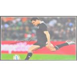 DAN CARTER; an autographed photograph of the legendary New Zealand Rugby Union player,