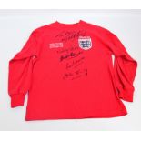 A Toffs replica red England football shirt embroidered "WORLD FOOTBALL CHAMPIONSHIPS FOOTBALL WORLD
