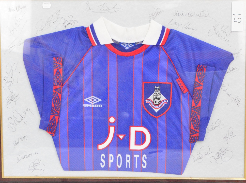 An Oldham Athletic football shirt, framed and glazed with multiple signatures to the back mount,