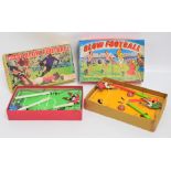 Two vintage Blow Football games, in their original boxes.