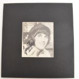 A George Best autograph signed to his photograph within a mount.