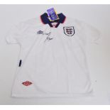 A replica England football shirt, signed and inscribed “To Martin” by Alan Shearer.