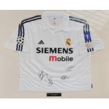 A Real Madrid football shirt, with plaque inscribed “The Real Legends, Old and New”,