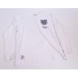 An Umbro Bobby Moore number 6, England 4 West Germany 2 30.7.66 replica football shirt.