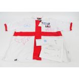 A white autographed Germany 1 England 5 football shirt, with original tags,