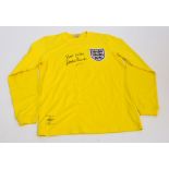 An Umbro Gordon Banks replica number 1 autographed yellow England goalkeeper's jersey.