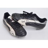 A pair of Puma Roger Hunt match worn, autographed boots,
