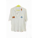 A multi-signed cricket jumper, and a training shirt, both belonging to Dermot Reeve,